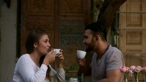 Couple Dating Drinking Coffee in Cafe