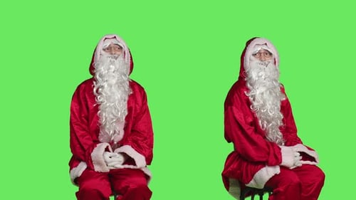 Santa Claus Seated Posing in Red Suit