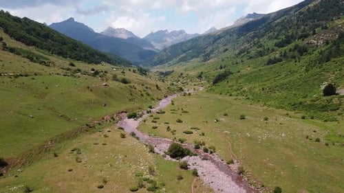 Spanish Pyrenees, Spain - Aerial Drone View of the Riverbed and Green Valley of Valle de Aguas Tuert
