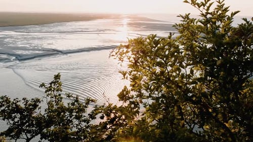 Aerial view of Mont Saint Michel Tide from the top of the hill, France. Slow motion