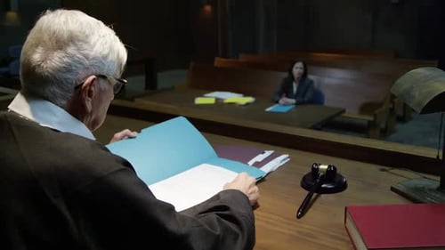 Senior Judge with Gavel in Courtroom