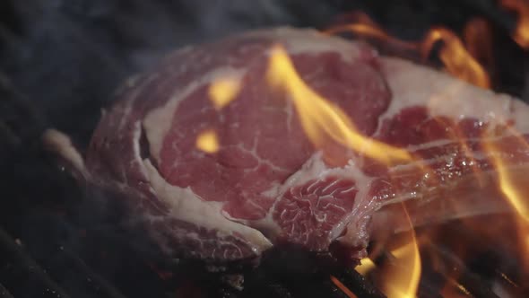 Grilled Meat with Fire Roast Meat with Fire Flames Beef Steak on Grill ...