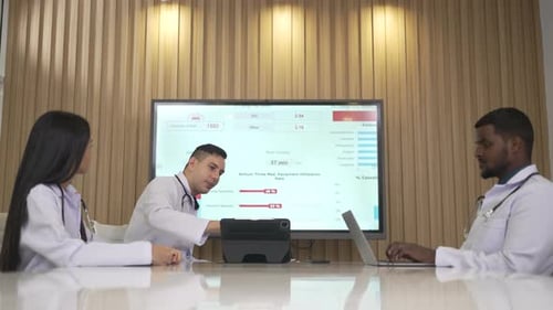 Medical Professionals Discussing Healthcare Data in Meeting