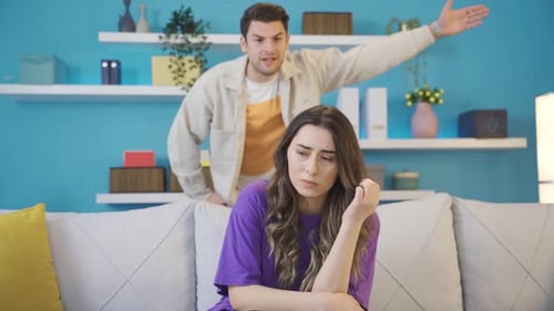 Upset Couple Arguing in Living Room
