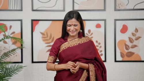 Happy Woman Smiles and Blows a Kiss