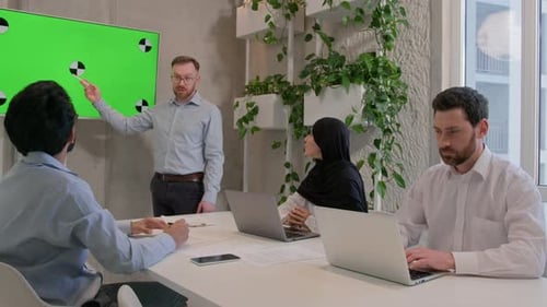Office Coworkers Partners Businessmen Businesswoman Looking on Chroma Key Presentation at Conference