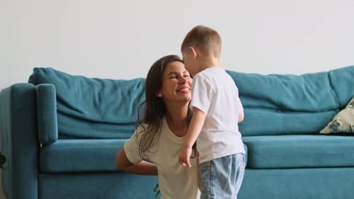 Loving Mother Receives Flowers from Child at Home
