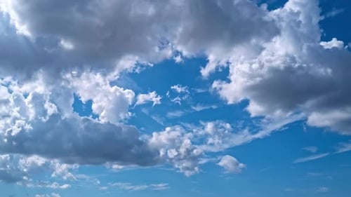 White Clouds Drifting across a Bright Blue Sky
