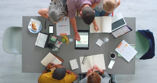 Diverse Team Brainstorming at Conference Table