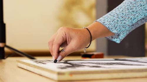 Exploring Charcoal Art Techniques in a Creative Studio Setting