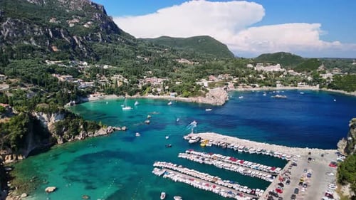 Aerial View of a Charming Coastal Town and Vibrant Sea in Liv