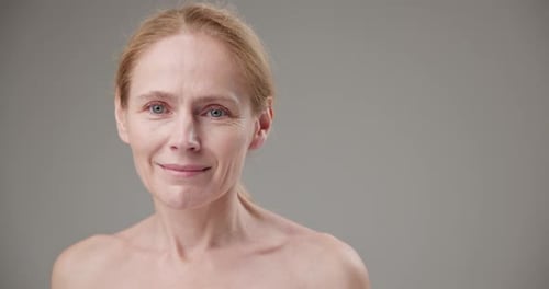 Beautiful Woman Smiling in Studio Close Up