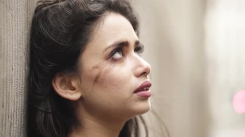 Crying young female alone on the street looking in to the sky nervous and scared slowmotion