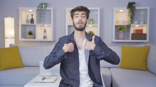 Man looking at camera making confidence sign.