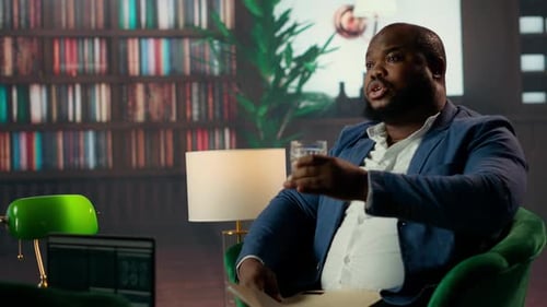Diverse CIA Officers Meeting in a Safe House Library Analyzing Confidential Data