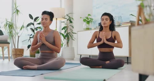 Women Perform Yoga, Meditation Indoors in Bright Room