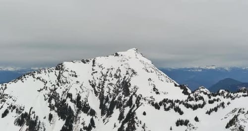 Snow Covered Rocky Mountain Peak surrounded by Scenic Mountain Landscape. British Columbia, Canada.