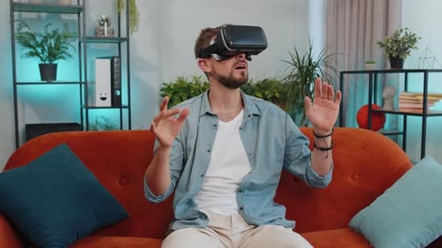 Man Enjoys Immersive Virtual Reality Experience at Home
