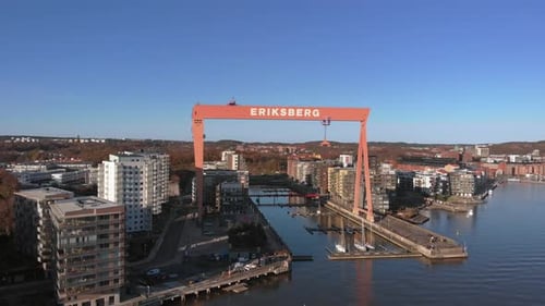 Aerial Establishing Shot of Old shipyard Eriksberg crane in Gothenburg during summer. Dolly movement