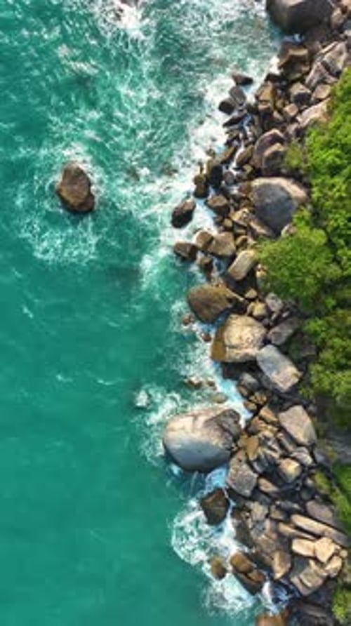 Stunning coastline view with rocky shore. Vertical video