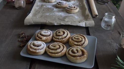 baked Swedish Cinnamon Buns on wooden table at home