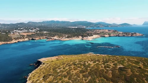 flying towards paradise like village of Cala Comte, Ibiza
