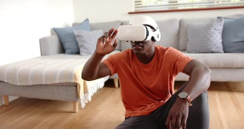 Man Using Virtual Reality Headset at Home
