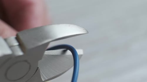 Wire Cutters Cutting Through Blue Wire