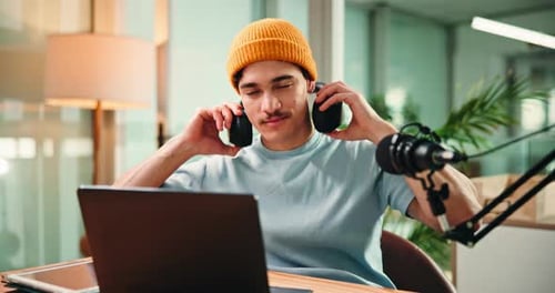 Laptop, face and man with mic in studio for podcast, broadcast and interview for talk show