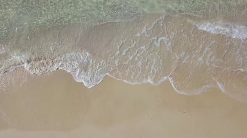 Beautiful empty beach with small waves - Aerial footage.