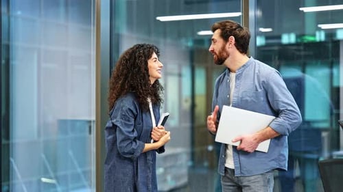 Business Professionals High Five in Office Celebration of Success