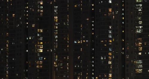 Apartment Building with Glowing Windows at Night