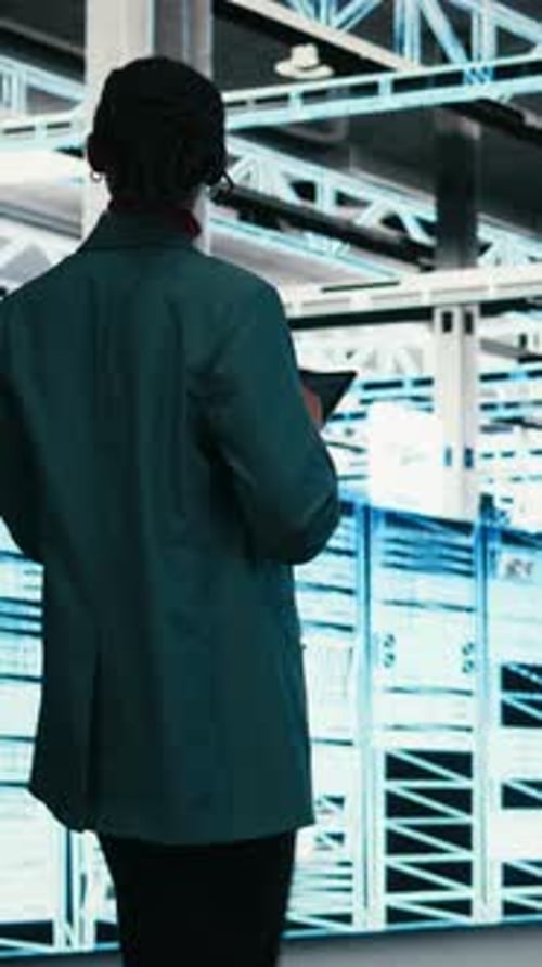 Vertical Video Female Programmer Walking in Data Center Using Tablet to Write Code