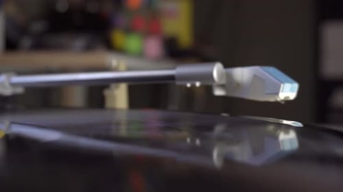 Close up of turntable needle dropping onto the record