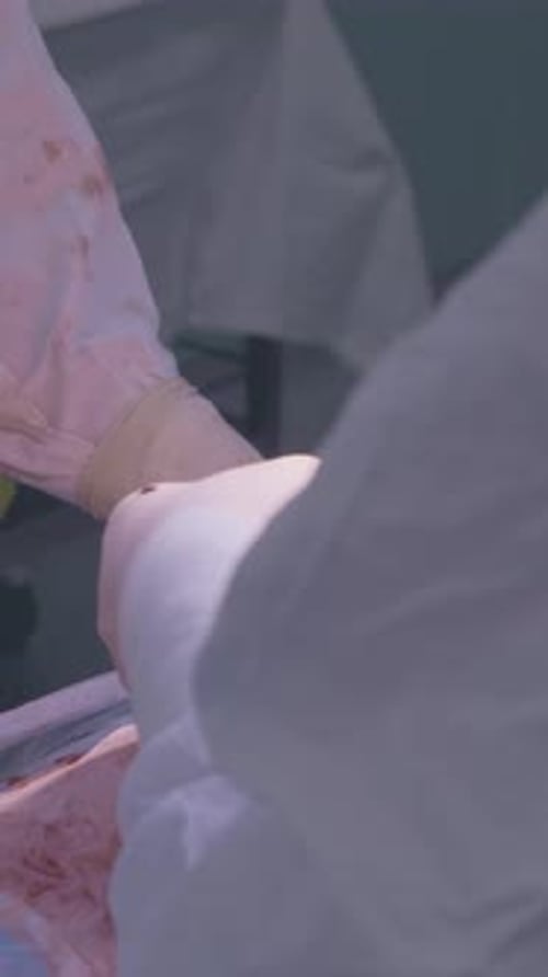 Medical Surgery with Gloved Hands and Tools