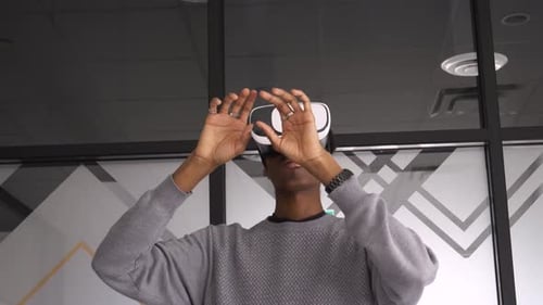 Creative Businessman Using Virtual Reality Goggles in Office Adult