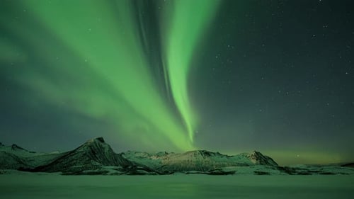 Beautiful Northern Lights moving across Mountains in Northern Norway