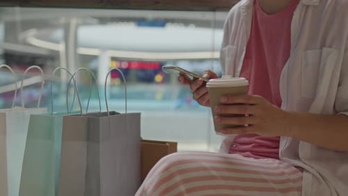 Client, Stylish Fashionista Drinking Coffee Holding A Phone In A Department Store, A Young Caucasian