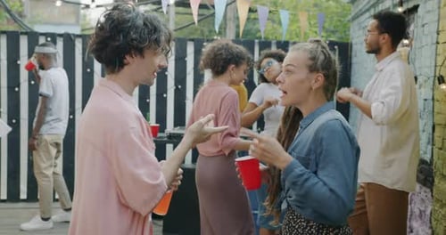 Friends Celebrate at an Urban Outdoor Party