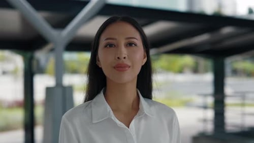 Close-up of Smiling Woman in Urban Setting