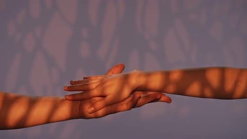 Man and Woman Hands Showing Gestures and Touching Crossing Fingers Isolated on Purple Studio