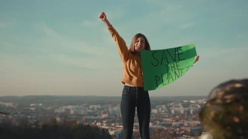 Activist Woman Holding Encouraging Green Poster Save the Planet Standing Calls Out Slogans Around