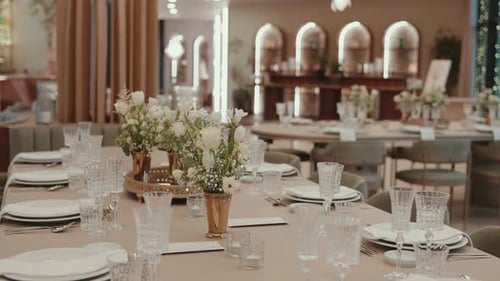 Elegant Wedding Reception Table Setting with Floral Centerpieces