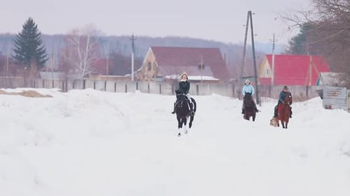 Winter Time Three Women Riding Horses in a Village with