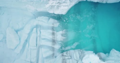 Majestic Ice Cave with Melting Blue Water Aerial