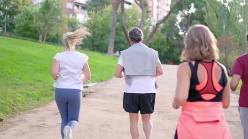 Senior Couple Running in the Park for a Healthy Lifestyle