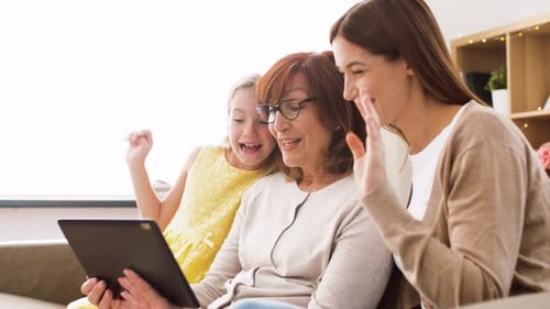 Grandmother, Mother, and Child Video Calling on Tablet