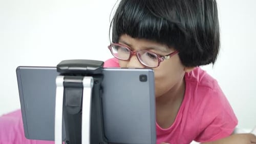 Child Using Tablet at Home