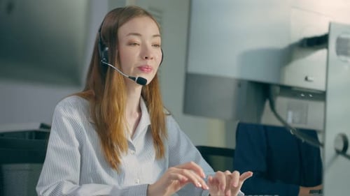 Beautiful Caucasian businesswoman call center work in office corporate.