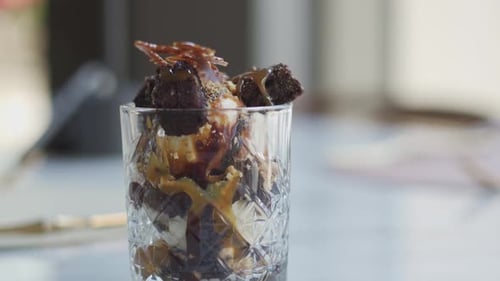ice cream served in a cup, close up shot, tilt up shot, tilt down shot